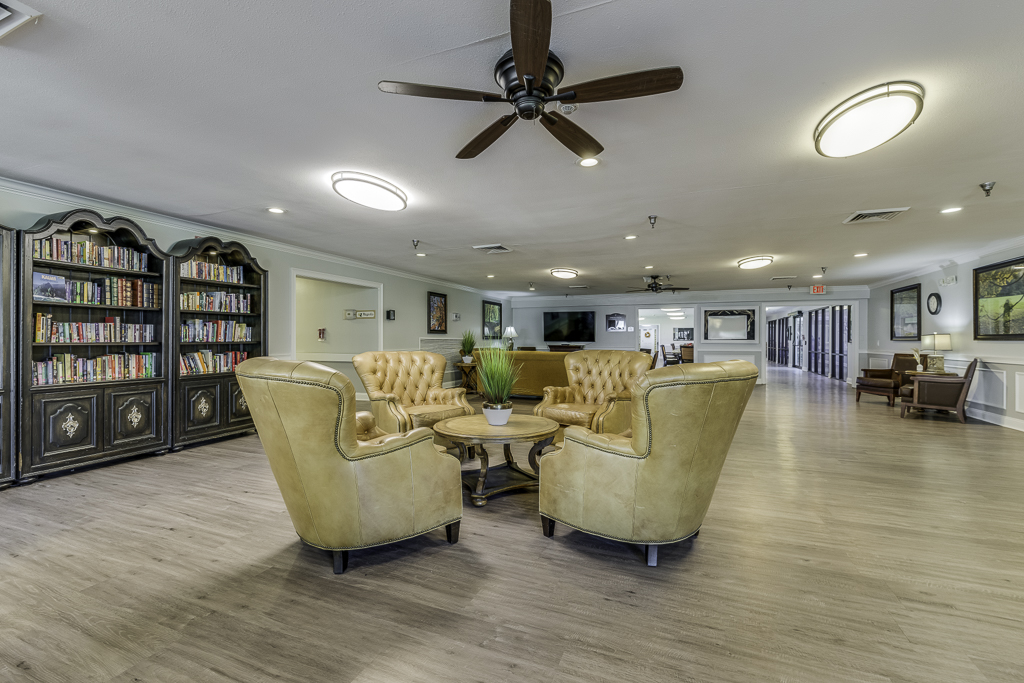 four yellow chairs around a table